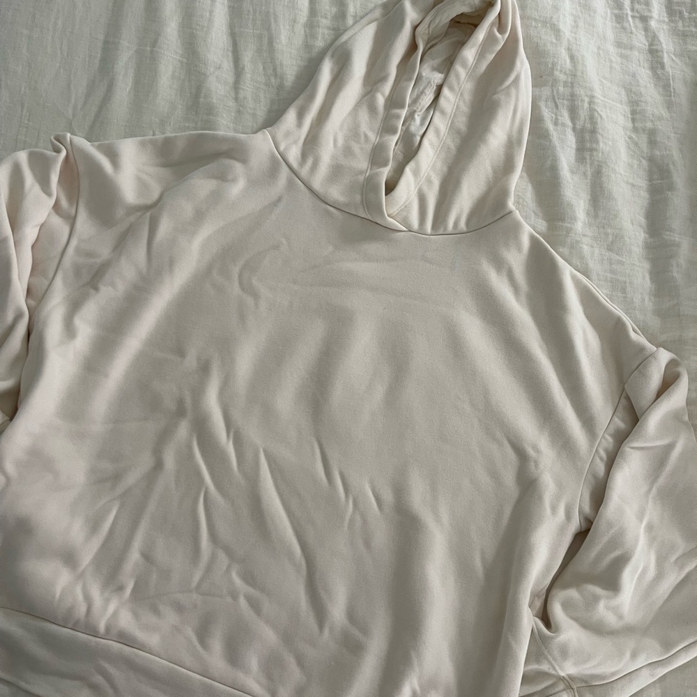 Fabletics cream colored hoodie with pockets